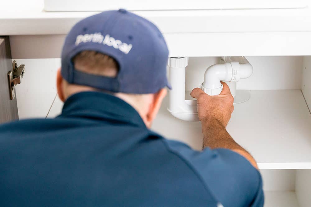 plumber fixing a leak