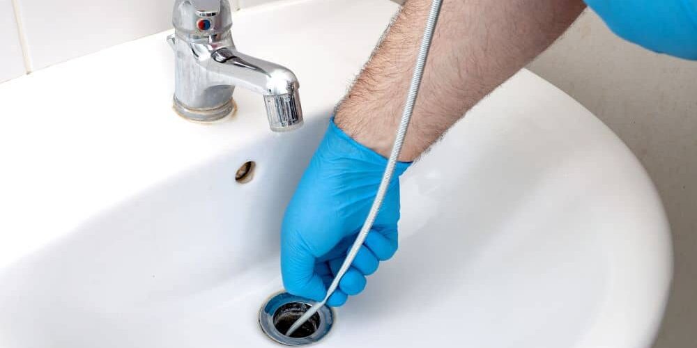 Cleaning clogged sink.