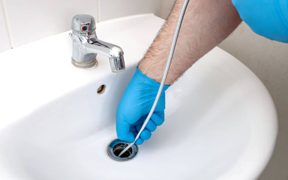 Cleaning clogged sink.