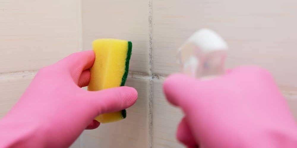 Cleaning bathroom tile.