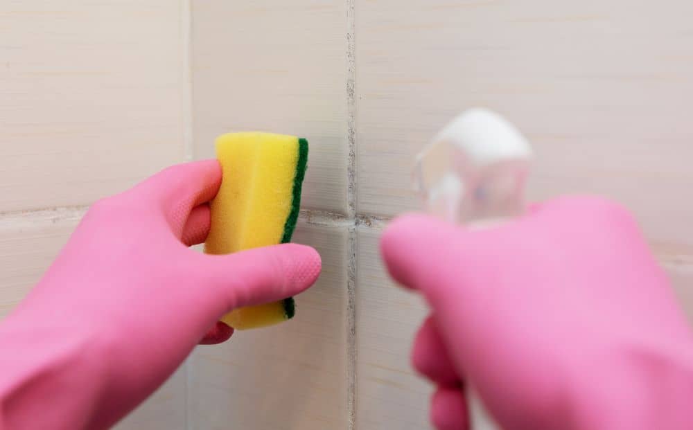 Cleaning bathroom tile.